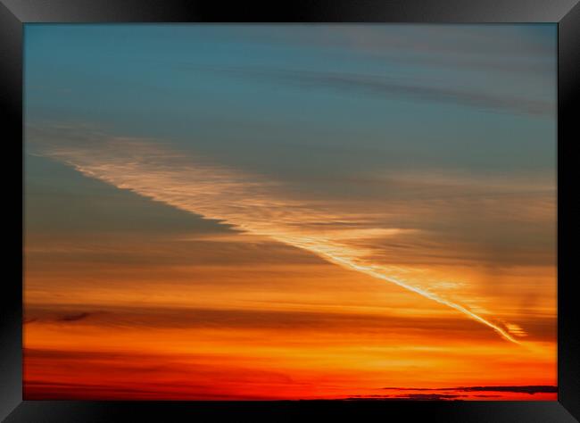 Contrail at sunset Framed Print by Rory Hailes