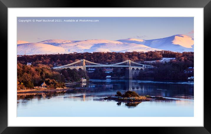 Menai Bridge and Snowdonia from Anglesey in Winter Framed Mounted Print by Pearl Bucknall