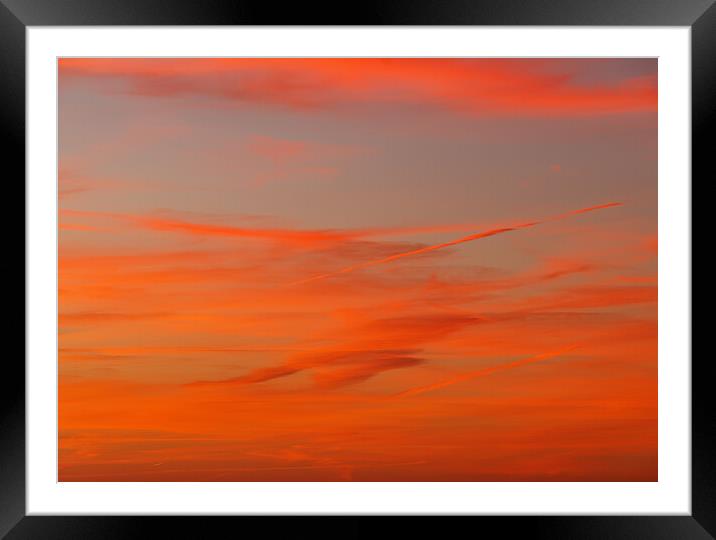 Contrails in a colourful sky Framed Mounted Print by Rory Hailes