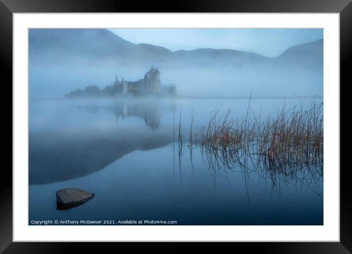 A misty sunrise on Kilchurn Castle  Framed Mounted Print by Anthony McGeever