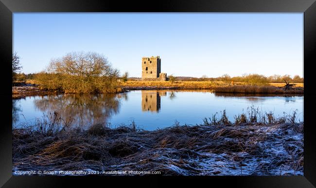 Threave Castle reflecting on the River Dee in the winter sun and Framed Print by SnapT Photography