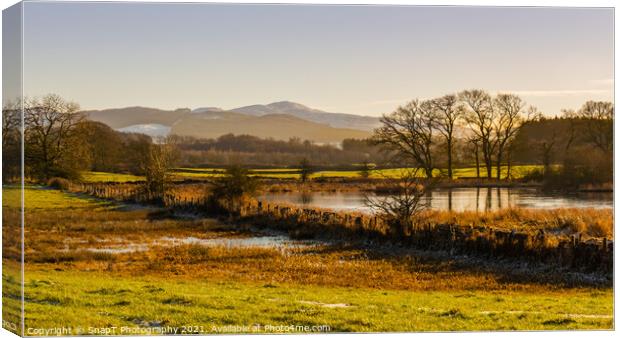 The River Dee in winter with a snow covered Bengairn Hill in the Canvas Print by SnapT Photography