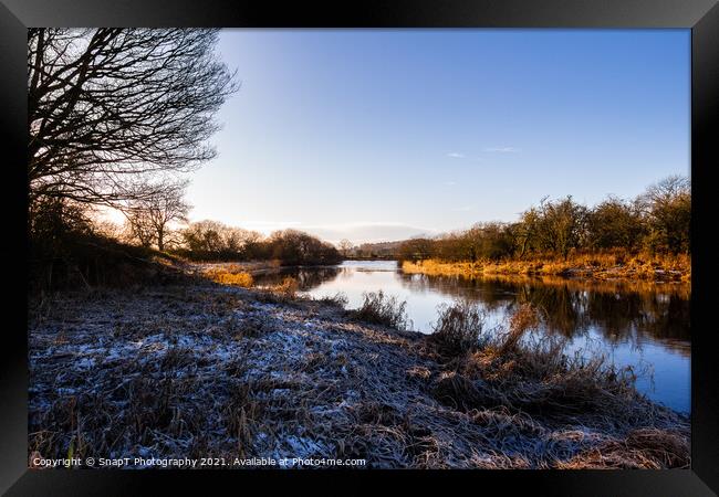 A winter scene on the River Dee at Threave castle, with snow and frost Framed Print by SnapT Photography
