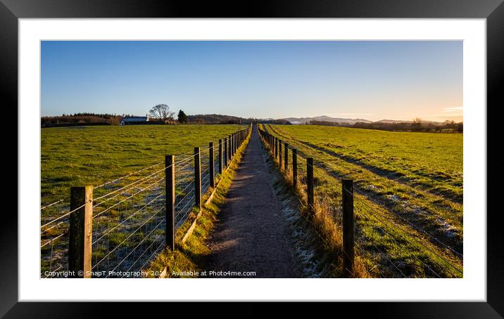 A fenced trail through agricultural land in the Scottish countryside in winter Framed Mounted Print by SnapT Photography