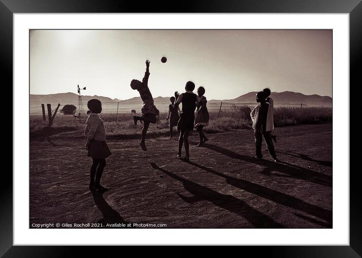 Children playing ball South Africa Framed Mounted Print by Giles Rocholl