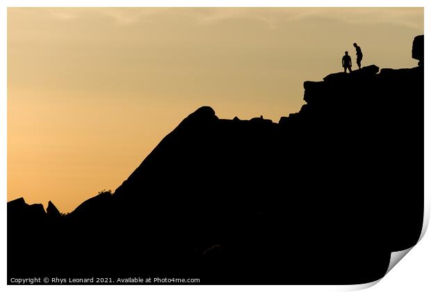 Two rock climbers look back from the summit of stanage edge in england Print by Rhys Leonard