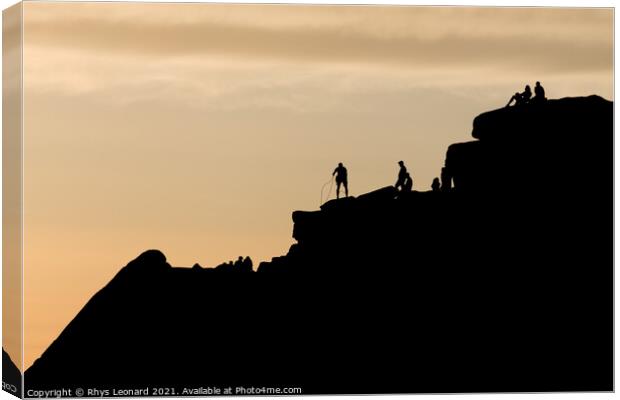 Striking sunset scene of stanage edge rock formations. People on top Canvas Print by Rhys Leonard