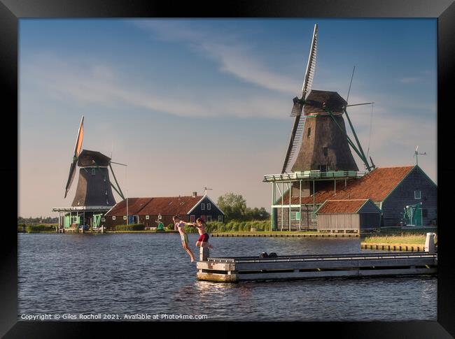 Children windmills and water Holland Framed Print by Giles Rocholl
