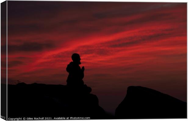 Praying monk at sunrise Canvas Print by Giles Rocholl