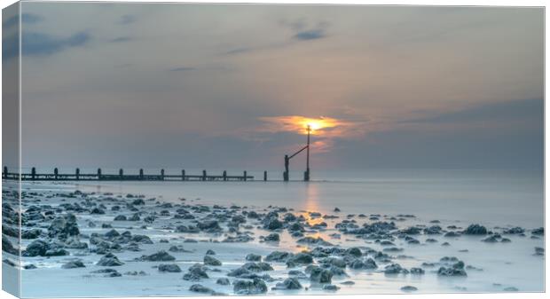 Sunset at Sheringham Beach Canvas Print by Robbie Spencer