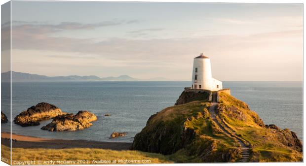 Radiant Sunset over Llanddwyn Lighthouse Canvas Print by Andy McGarry