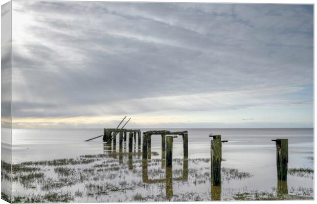 The old pier at Snetisham Beach Canvas Print by Robbie Spencer