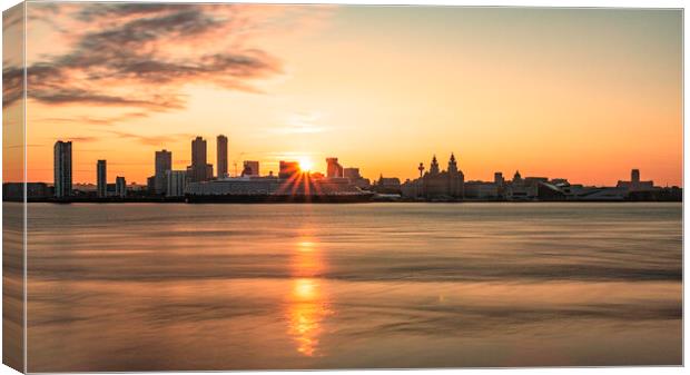 A sunrise over the river mersey with the Liverpool skyline. Canvas Print by Kevin Elias