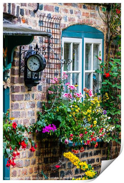 Flowers and a clock outside an English country cottage  Print by Kevin Hellon