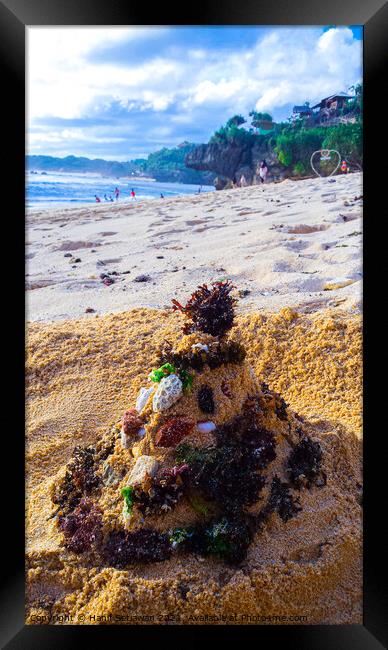 Santa Claus built from sand seaweed and stones at a sand beach 2b Framed Print by Hanif Setiawan