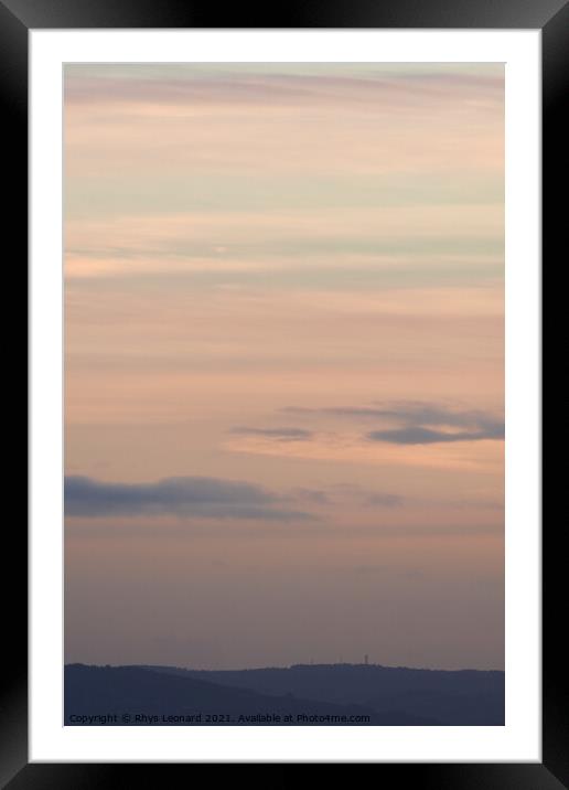 Vertical hazy sunset. Horizon under warm and faded pastel colours. Framed Mounted Print by Rhys Leonard