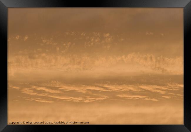 Golden sunset sky, telephoto perspective gives abstract background Framed Print by Rhys Leonard