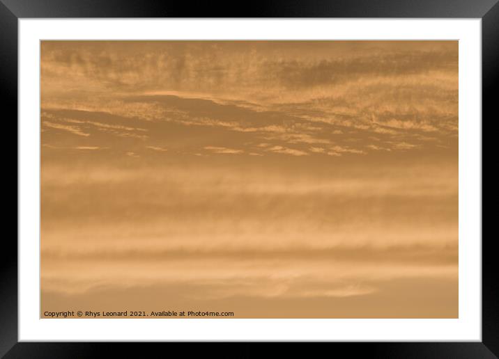Abstract sky background of deep golden sunset clouds. Full frame Framed Mounted Print by Rhys Leonard