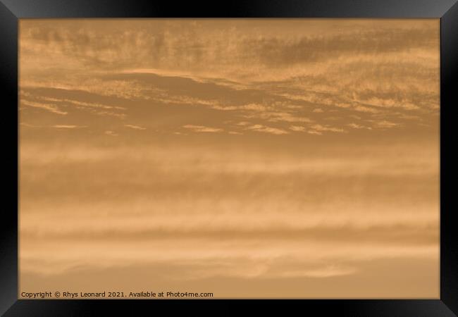 Abstract sky background of deep golden sunset clouds. Full frame Framed Print by Rhys Leonard
