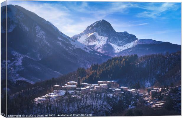 Snowy village and Apuan mountains in winter. Canvas Print by Stefano Orazzini