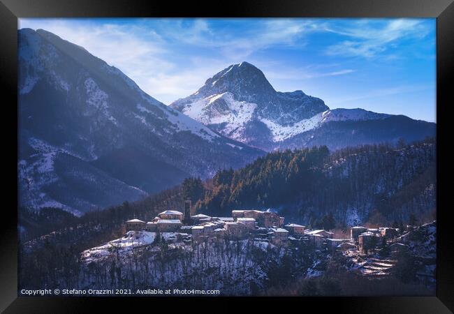 Snowy village and Apuan mountains in winter. Framed Print by Stefano Orazzini