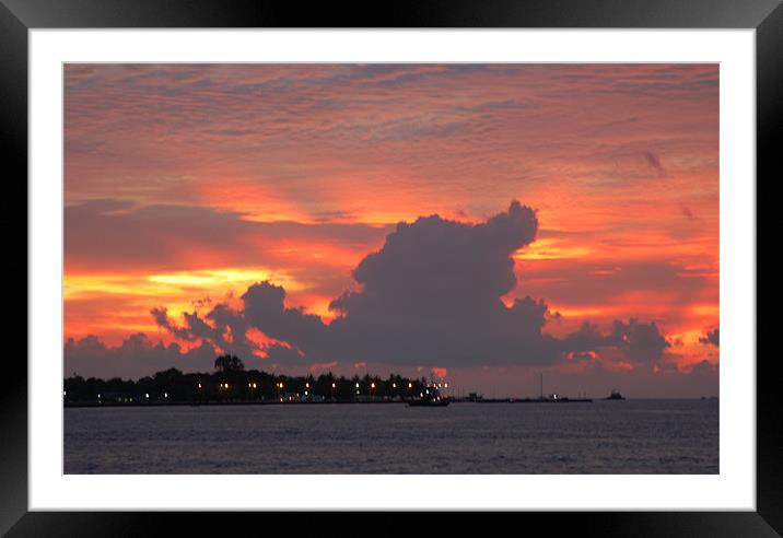 sunset behind island Framed Mounted Print by Hassan Najmy