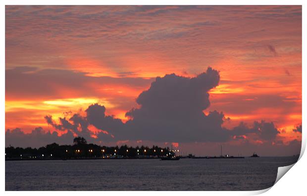 sunset behind island Print by Hassan Najmy