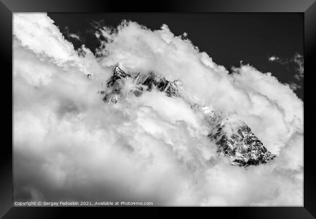 Himalayas covered by snow and clouds. Framed Print by Sergey Fedoskin