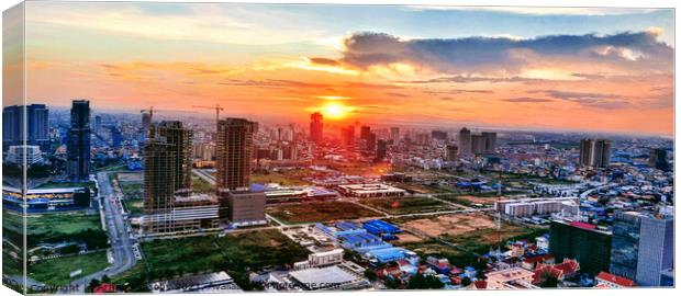 The sun sets over Phnom Penh... Canvas Print by Arnaud Jacobs
