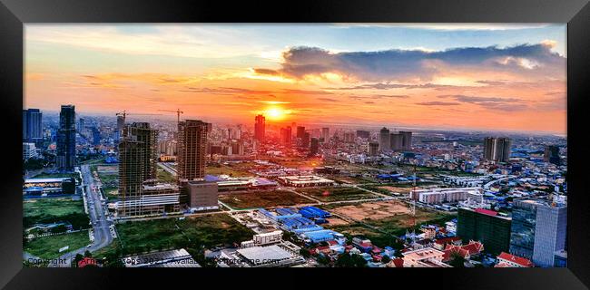 The sun sets over Phnom Penh... Framed Print by Arnaud Jacobs