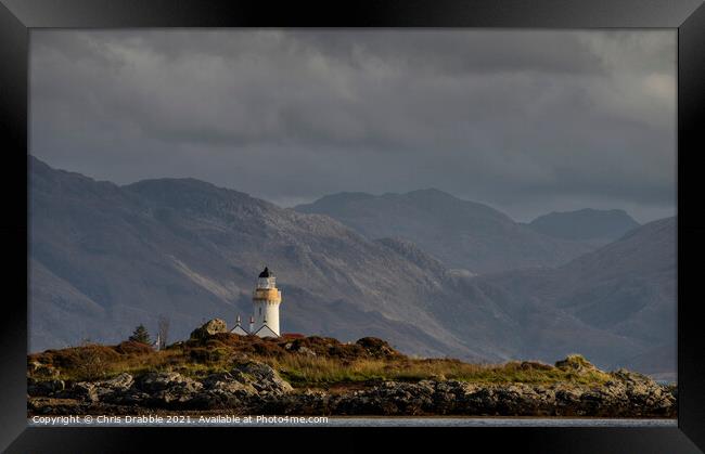 Dark clouds over Isleornsay Lighthouse Framed Print by Chris Drabble
