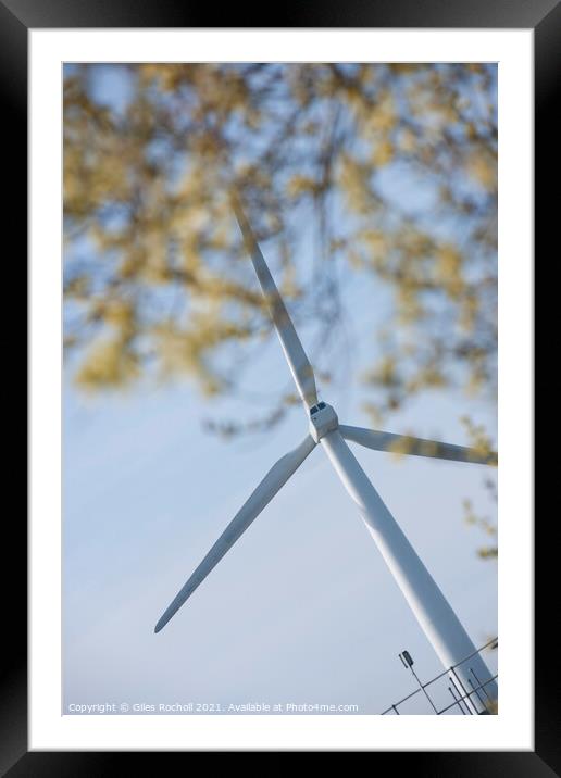 Wind turbine and tree foliage Framed Mounted Print by Giles Rocholl