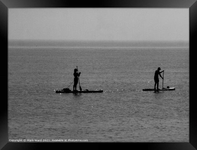 Paddleboard Silhouettes in Monochrome. Framed Print by Mark Ward