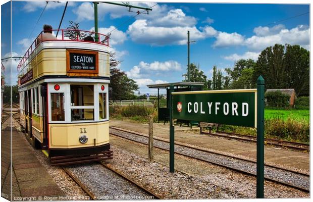 Electric Tram Arriving at Colyford Station Canvas Print by Roger Mechan