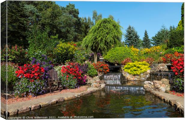 flowers and waterfall in a garden in holland Canvas Print by Chris Willemsen