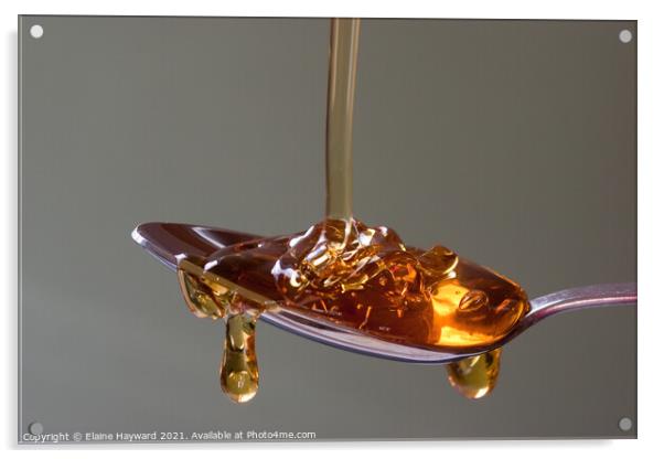 Golden syrup dripping from a silver spoon Acrylic by Elaine Hayward
