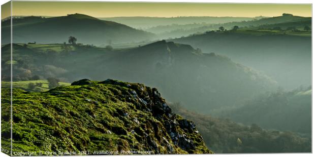 Thor's Cave from Wetton Hill in low winter light Canvas Print by Chris Drabble