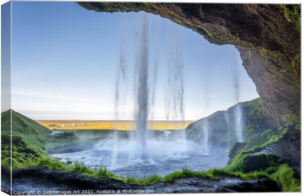 Iceland. Walking behind Seljalandsfoss waterfall Canvas Print by Delphimages Art
