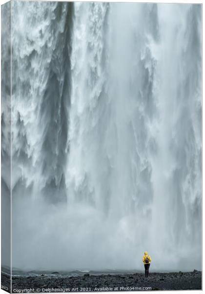 Iceland. Woman looking at Skogafoss waterfall Canvas Print by Delphimages Art