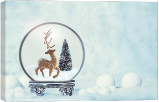 Winter Snow Globe With Reindeer Figure Canvas Print by Amanda Elwell