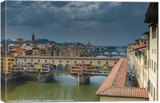 Ponte Vecchio under a Stormy Sky Canvas Print by Nick Hirst