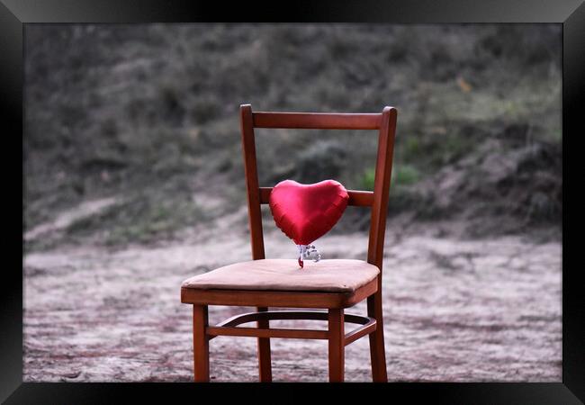 Red heart on the chair Framed Print by Stan Lihai