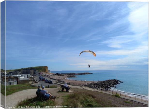 Paragliding over  west Bay Jurassic coast Canvas Print by Les Schofield