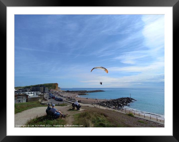 Paragliding over  west Bay Jurassic coast Framed Mounted Print by Les Schofield