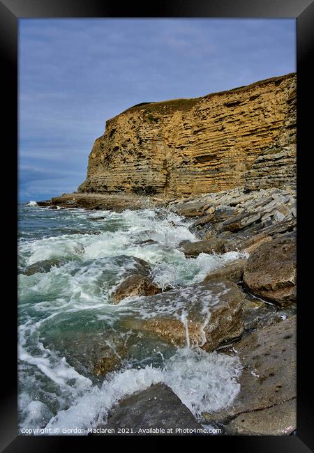 Waves crashing on on the rocks at Southerndown Framed Print by Gordon Maclaren
