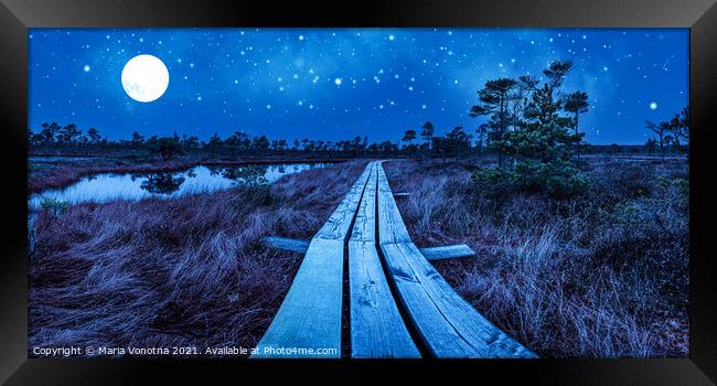 Wooden trail over night swamp Framed Print by Maria Vonotna