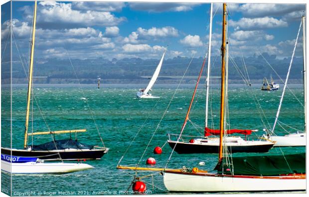 Sailing in the Solent on choppy water Canvas Print by Roger Mechan