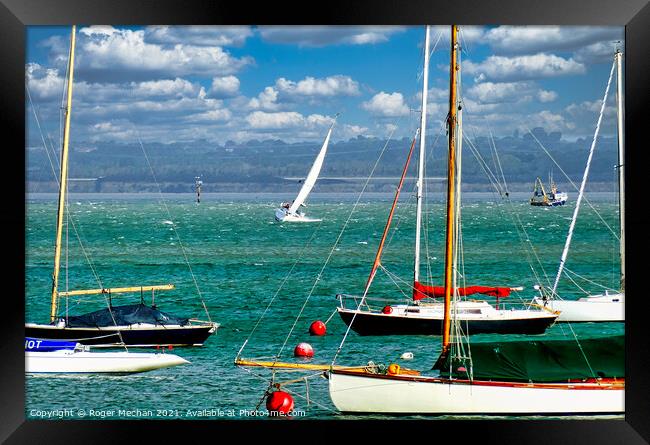 Sailing in the Solent on choppy water Framed Print by Roger Mechan