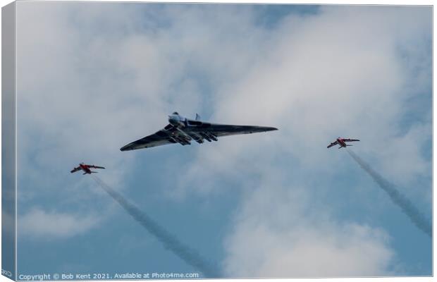 Vulcan XH558 with Red Arrows Escort Canvas Print by Bob Kent