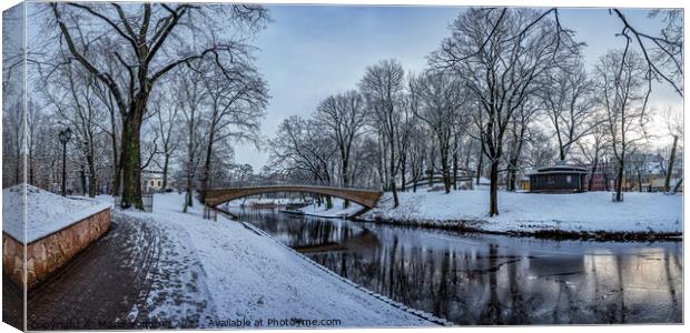 Winter park with stone bridge and canal Canvas Print by Maria Vonotna